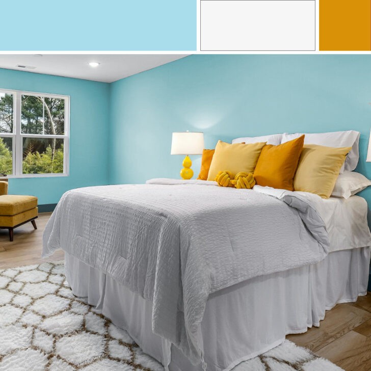 Dormitorio con paredes en color azul aguamarina y blanco, con almohadones en mostaza